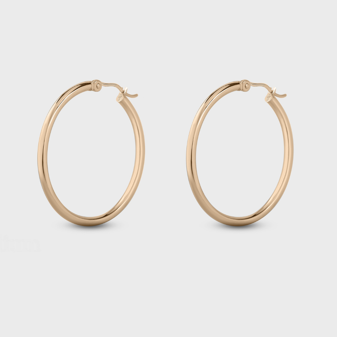 classic medium yellow gold hoops on model