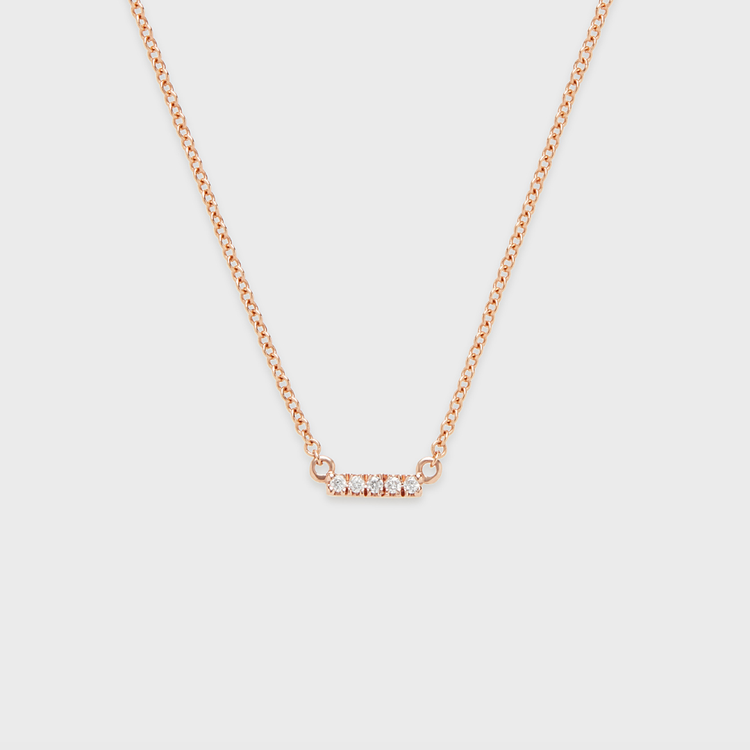 Rose gold bar pendant necklace with a row of round natural diamonds