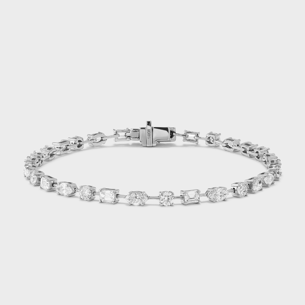 A white gold tennis bracelet with mixed fancy shaped natural diamonds.