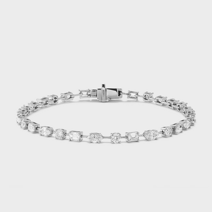 A white gold tennis bracelet with mixed fancy shaped natural diamonds.