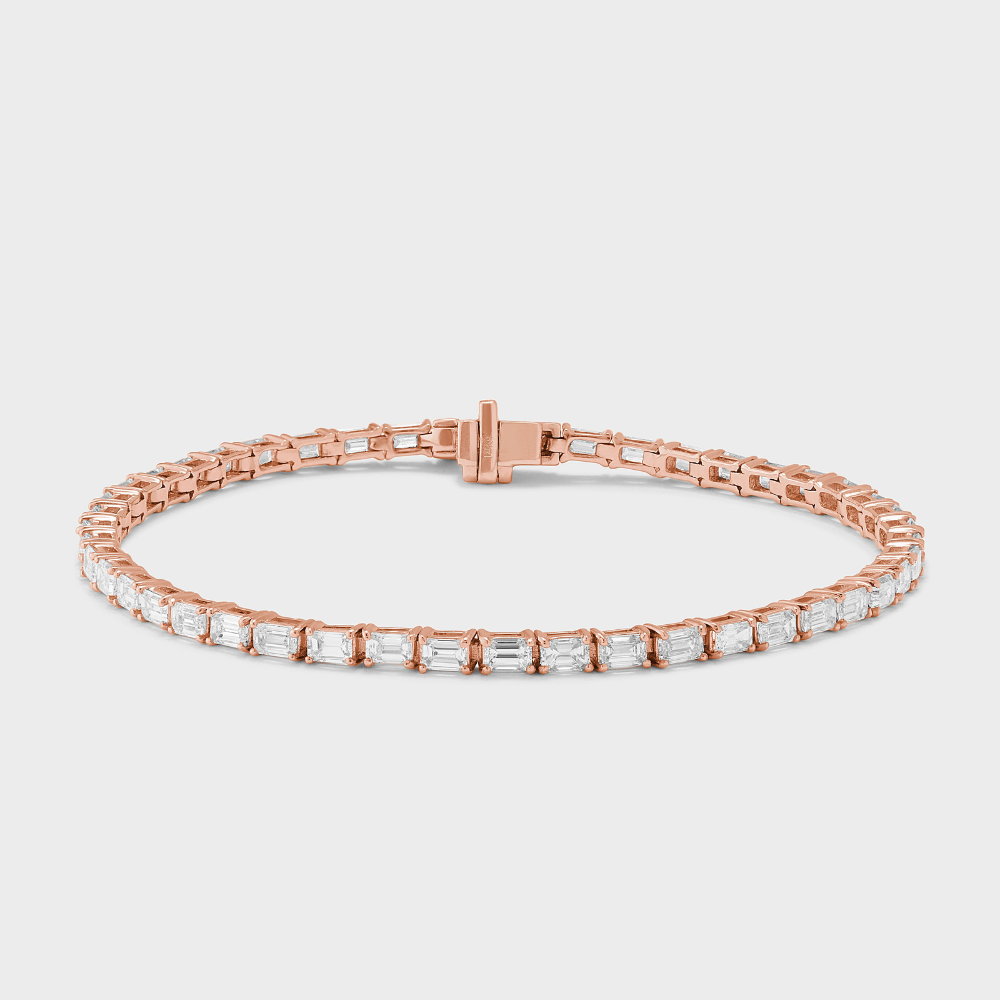 natural diamond tennis bracelet with emerald cut diamonds set east-west in rose gold