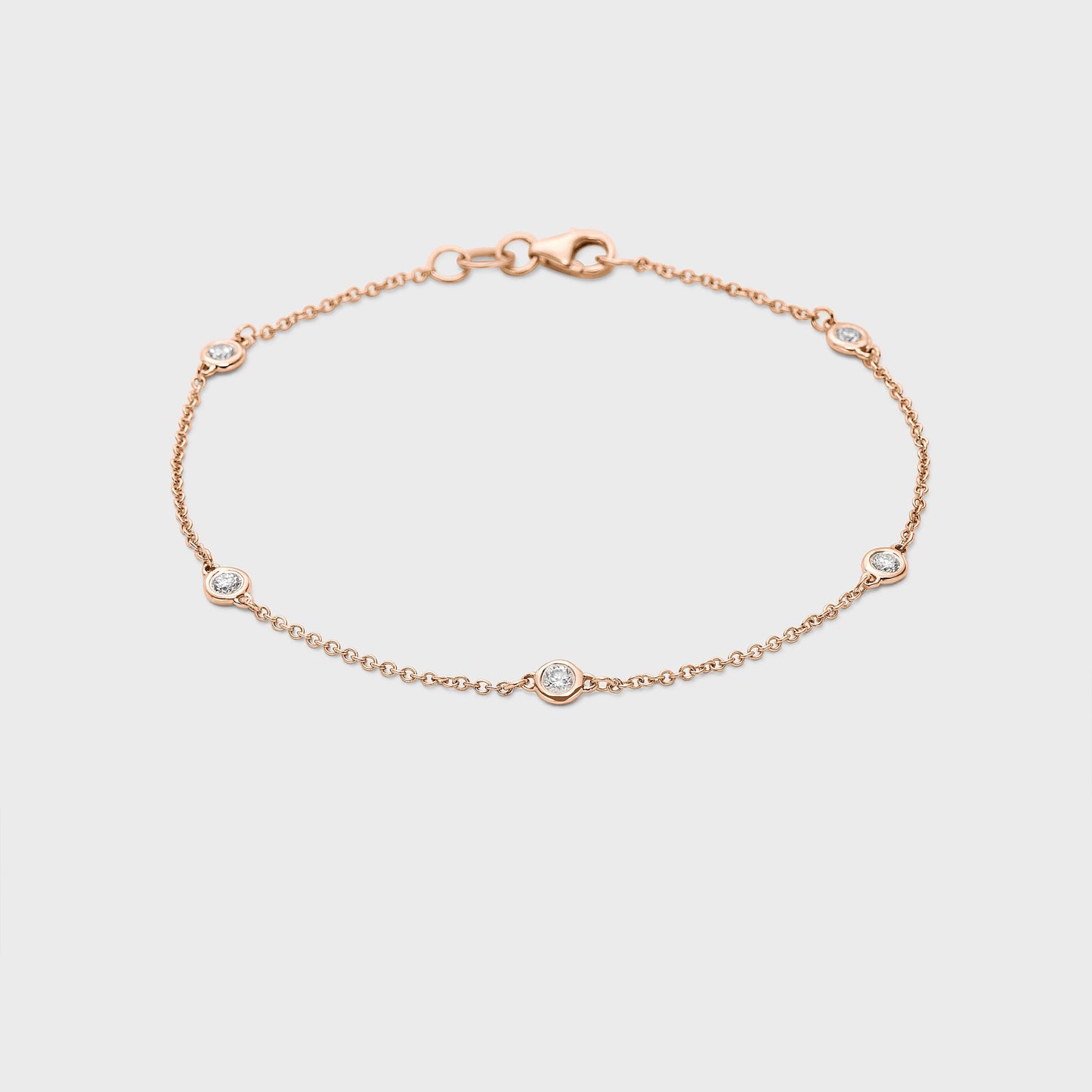 rose gold station bracelet with round natural diamonds placed equal distance apart