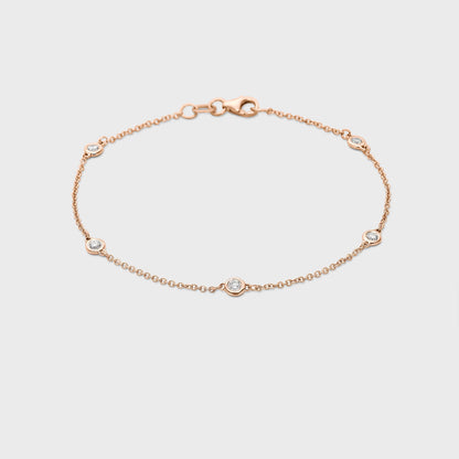 rose gold station bracelet with round natural diamonds placed equal distance apart