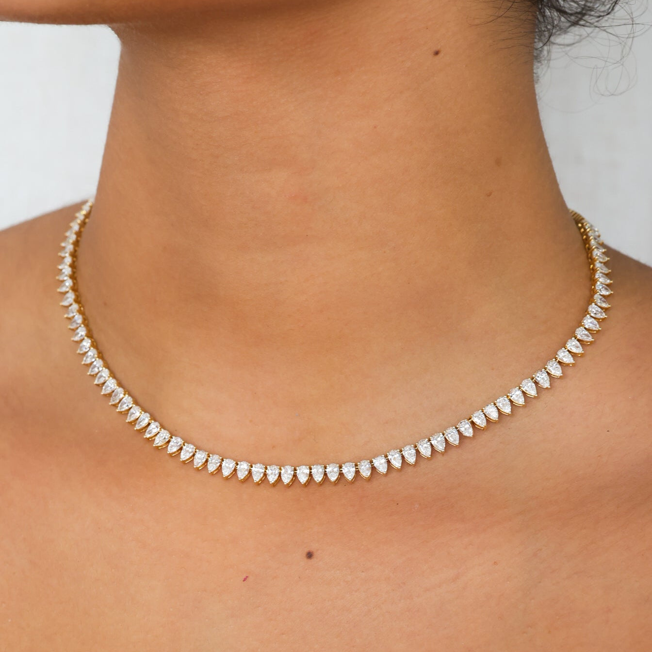 pear shape diamond tennis necklace on model