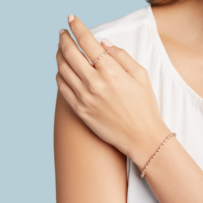 A rose gold bracelet with diamond accents. On model wrist shot. 