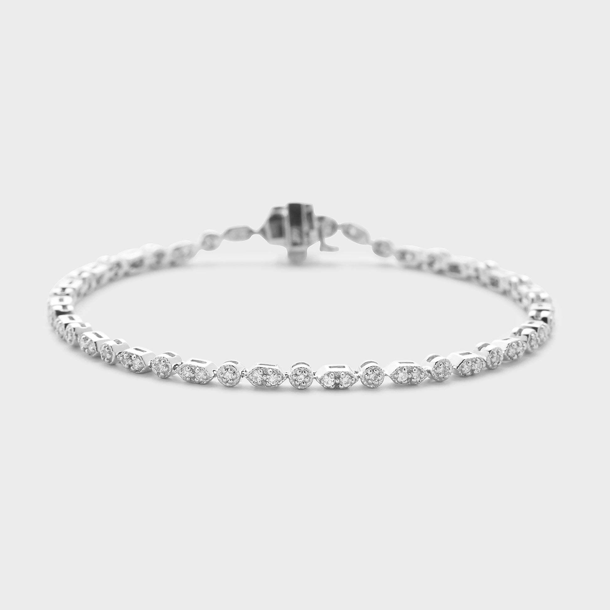 A white gold bracelet with diamond accents, displayed against a white background.