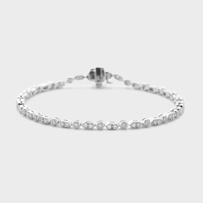 A white gold bracelet with diamond accents, displayed against a white background.